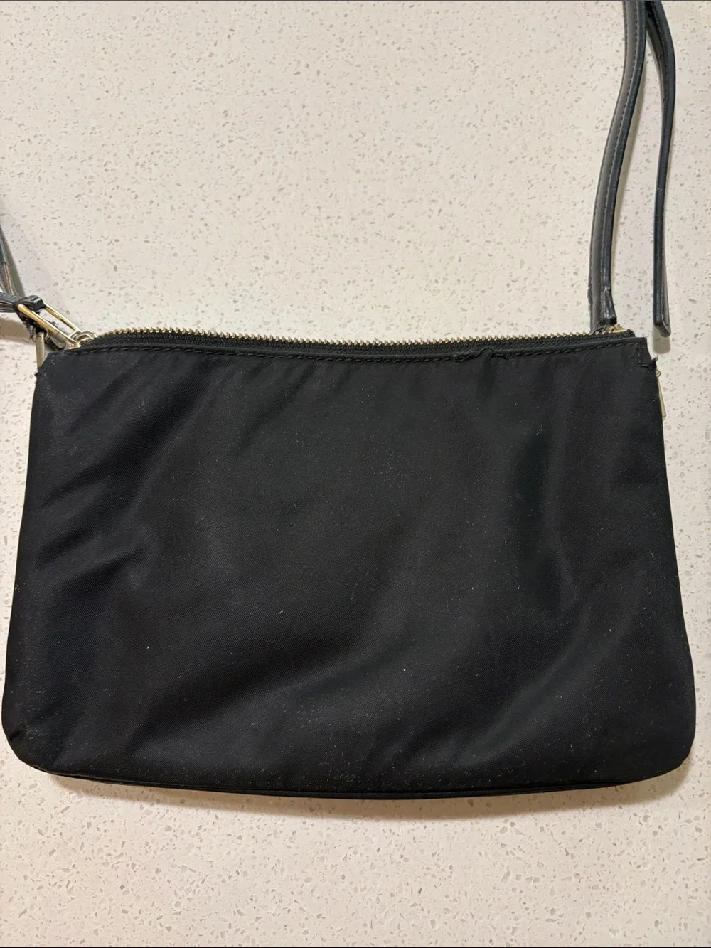 kate spade black crossbody pouch with gold-tone logo